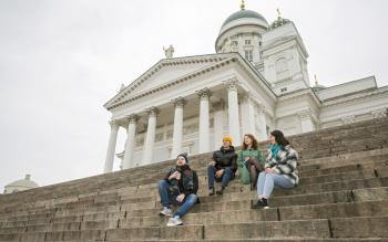 Students meeting on the steps by the Helsinki cathedral